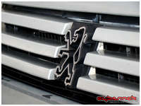 ...three-bar front grille with 80's Peugeot Lion logo...