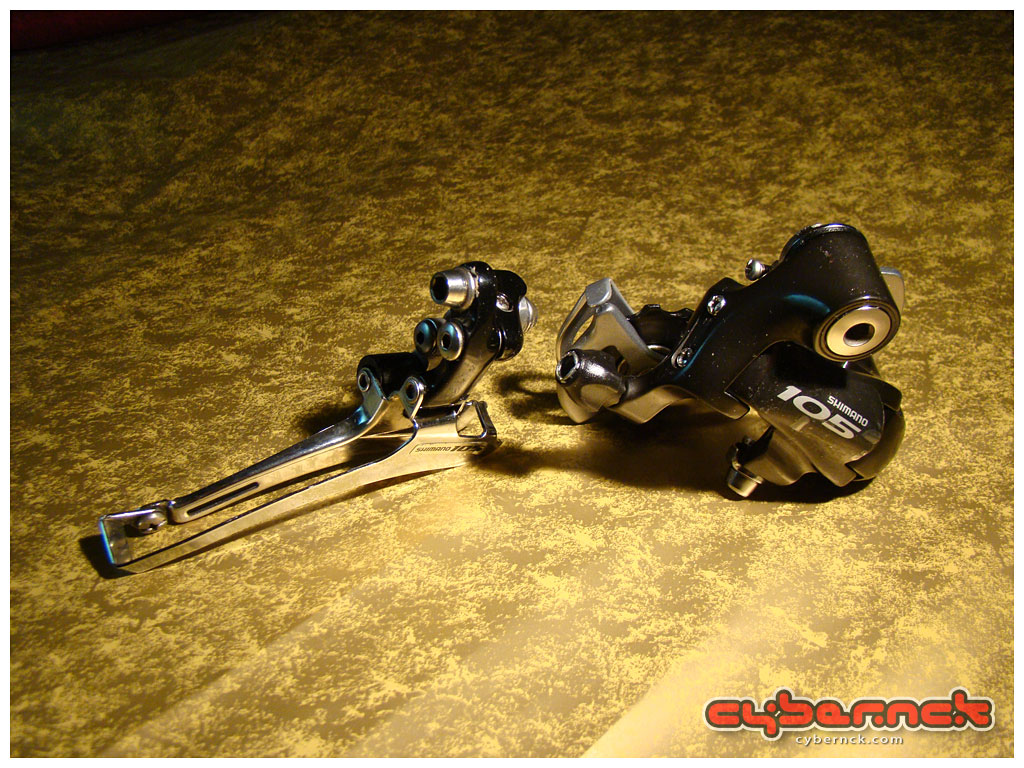 Shimano 105 5502 Black front derailleur and Shimano 105 5600 Black rear derailleur - allows for 10-speed conversion later on and/or easily replaced by a better rear der, if needs be.